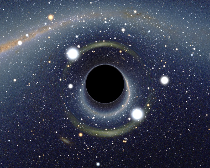 A black hole distorting spacetime and light in front of the Large Magellanic Cloud